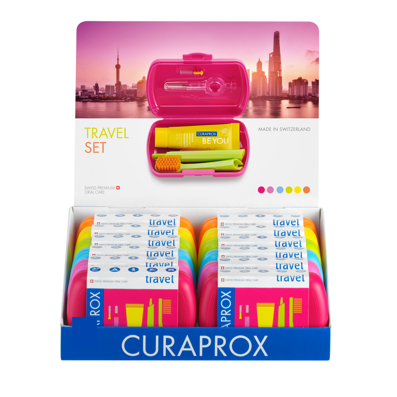Expositor 12 Pack – 12 Sets de viaje de colores: 1 Cepillo de dientes + 1 Pasta + 1 Interdental